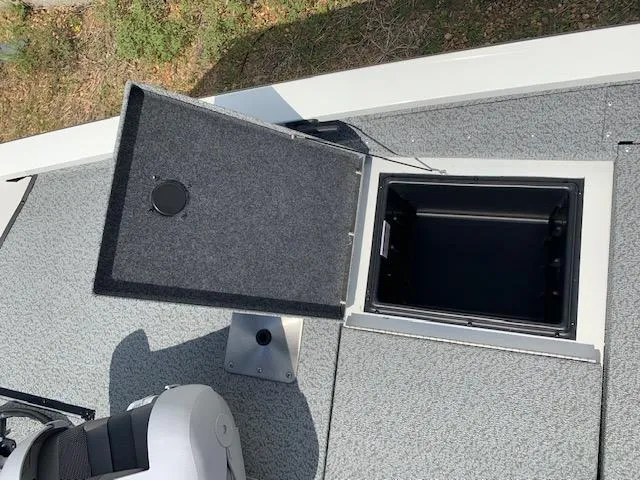 Slide: The Image of 2021 G3 Sportsman 1710 PFX boat storage compartment with open lid. - 6