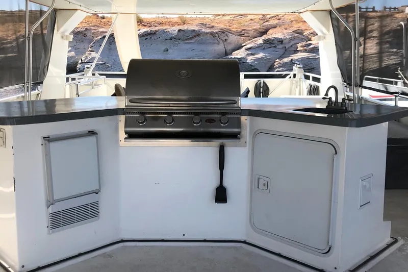 Slide: The Image of Outdoor seating area on a 2005 Custom The Entourage Shares 20 & 35 boat. - 20