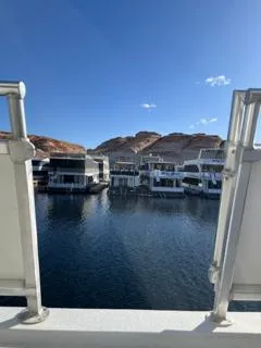 Slide: The Image of Custom 2005 The Entourage Shares 20 & 35 boat deck with railing and storage compartment. - 23