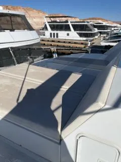 Slide: The Image of View from Custom The Entourage Shares 20 & 35 houseboat, 2005, overlooking calm water and docks. - 25