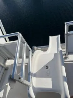 Slide: The Image of Alt text: Custom 2005 boat model 'The Entourage Shares 20 & 35' docked at marina. - 28