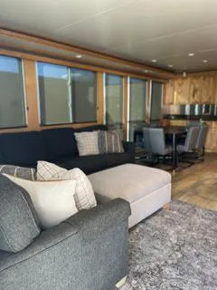 Slide: The Image of Modern houseboat interior with cozy seating and dining area, Custom The Entourage Shares 20 & 35, 2005. - 7