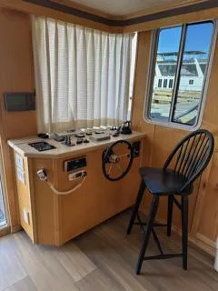 Slide: The Image of Compact RV bathroom with shower, toilet, and vanity in a 2005 Custom Entourage Shares 20 & 35. - 9