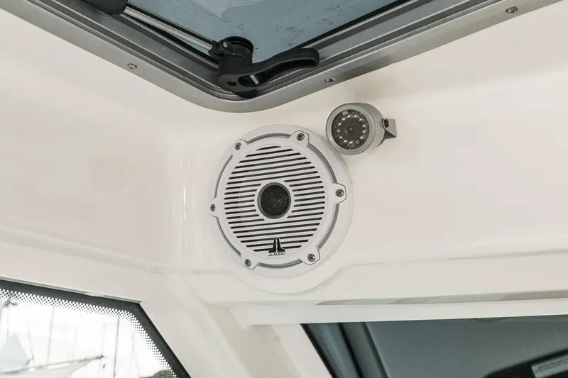 Slide: The Image of Speaker and camera on 2019 Boston Whaler 315 Conquest boat interior. - 101