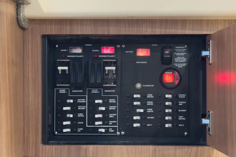 Slide: The Image of Electrical control panel on a 2019 Boston Whaler 315 Conquest boat. - 118