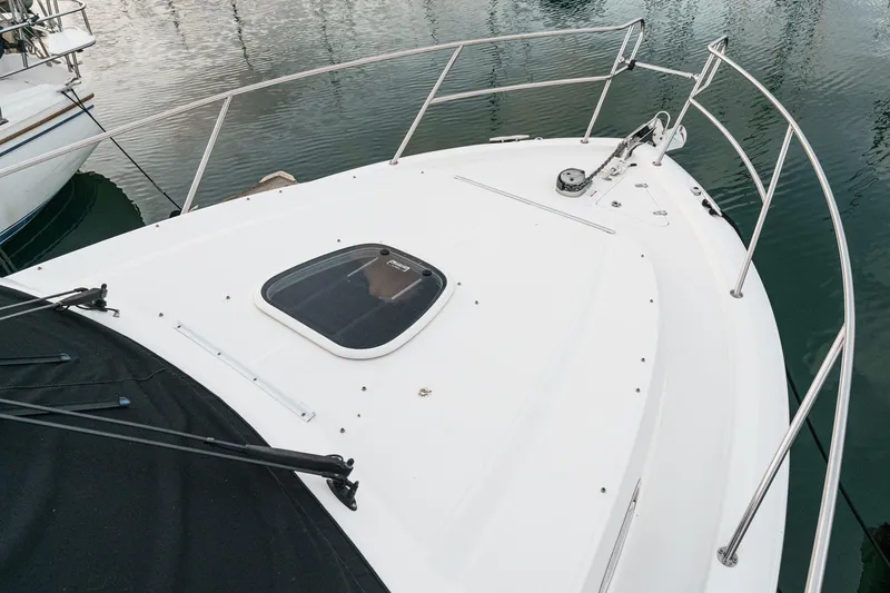 Slide: The Image of 2019 Boston Whaler 315 Conquest boat deck with railing and hatch. - 122