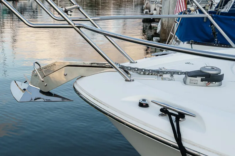 Slide: The Image of 2019 Boston Whaler 315 Conquest boat anchor and chain detail at dock. - 123