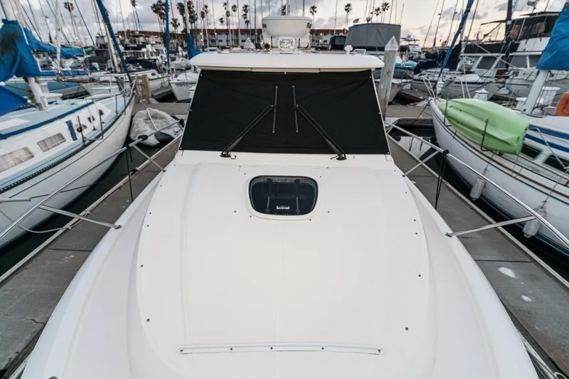 Slide: The Image of 2019 Boston Whaler 315 Conquest docked among sailboats at a marina. - 125