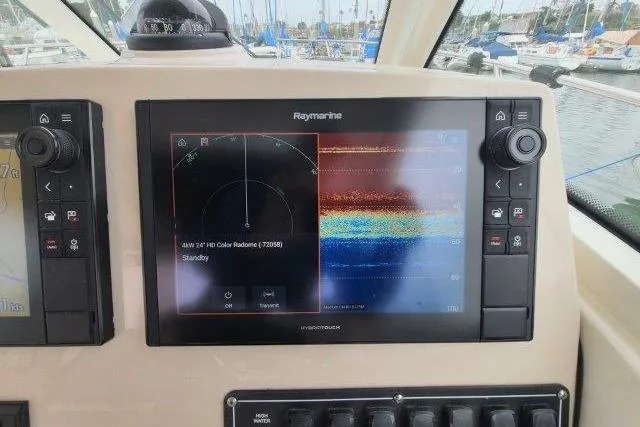 Slide: The Image of Raymarine navigation display on 2019 Boston Whaler 315 Conquest boat dashboard. - 32