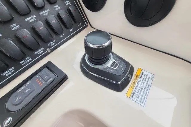 Slide: The Image of Control panel of a 2019 Boston Whaler 315 Conquest boat with joystick and switches. - 33