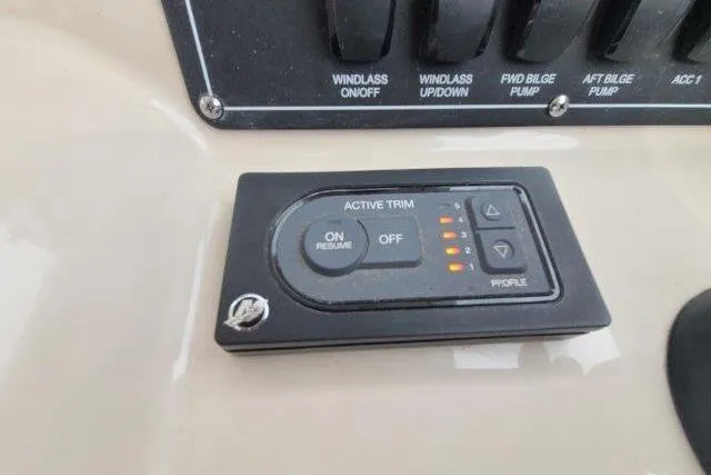 Slide: The Image of Control panel of a 2019 Boston Whaler 315 Conquest boat with active trim settings. - 34