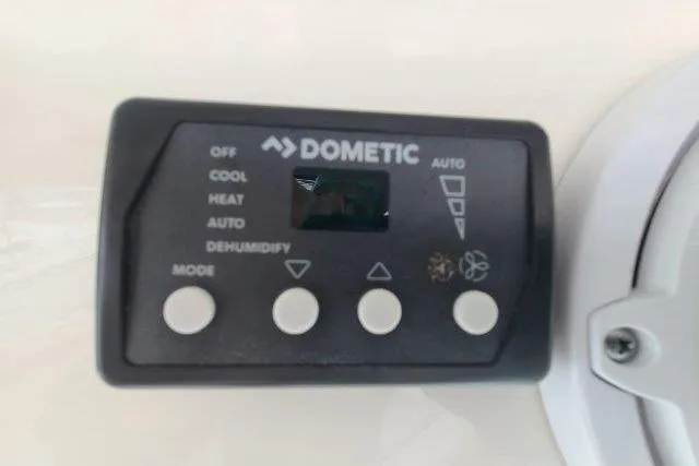 Slide: The Image of Dometic control panel on 2019 Boston Whaler 315 Conquest, featuring mode and fan settings. - 38