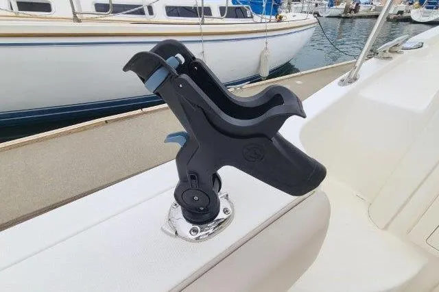 Slide: The Image of Rod holder on 2019 Boston Whaler 315 Conquest boat, docked at marina. - 46