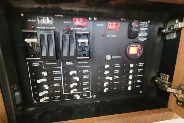 Slide: The Image of Electrical control panel on a 2019 Boston Whaler 315 Conquest boat. - 60
