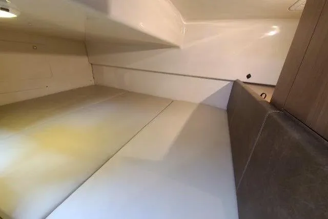 Slide: The Image of Interior cabin of 2019 Boston Whaler 315 Conquest, featuring sleek, modern design and comfortable seating. - 65