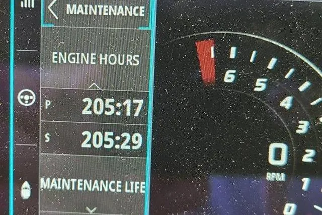 Slide: The Image of Dashboard of 2019 Boston Whaler 315 Conquest showing engine hours and RPM gauge. - 73