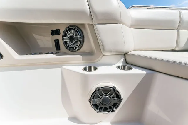 Slide: The Image of 2019 Boston Whaler 315 Conquest boat seat, featuring a foldable cushioned bench. - 78