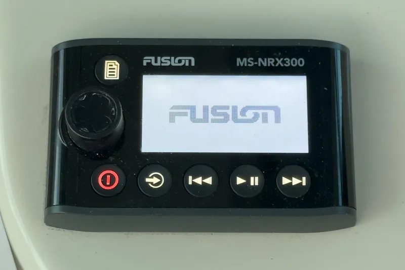 Slide: The Image of Fusion MS-NRX300 marine stereo controller on a 2019 Boston Whaler 315 Conquest. - 99