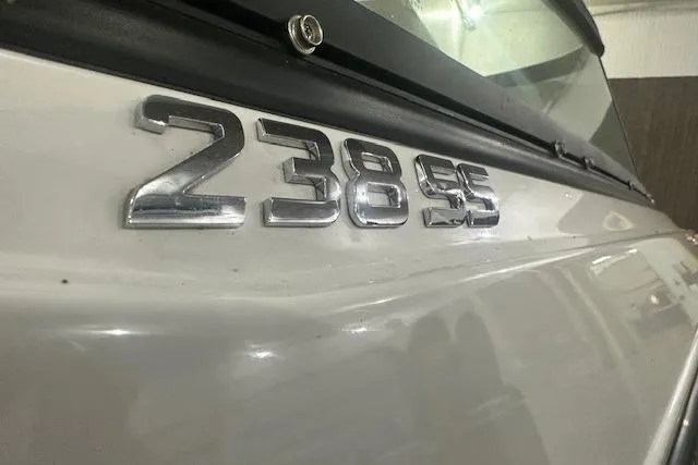 Slide: The Image of 2022 Monterey 238SS Super Sport boat emblem close-up, showcasing sleek design. - 10