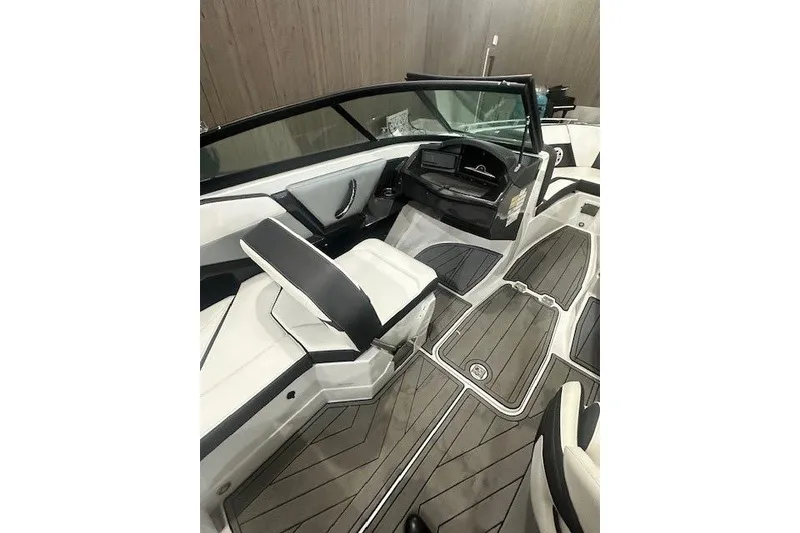 Slide: The Image of 2022 Monterey 238SS Super Sport boat interior with sleek seating and modern dashboard design. - 11