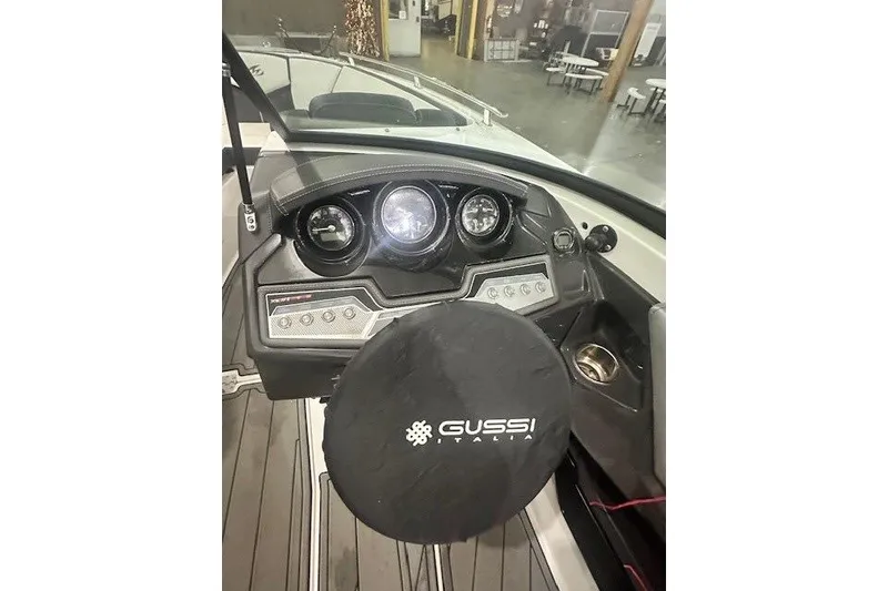 Slide: The Image of 2022 Monterey 238SS Super Sport dashboard with Gussi Italia steering wheel cover. - 13