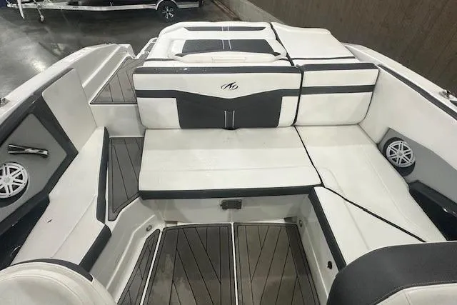 Slide: The Image of 2022 Monterey 238SS Super Sport boat interior with white and gray seating. - 15