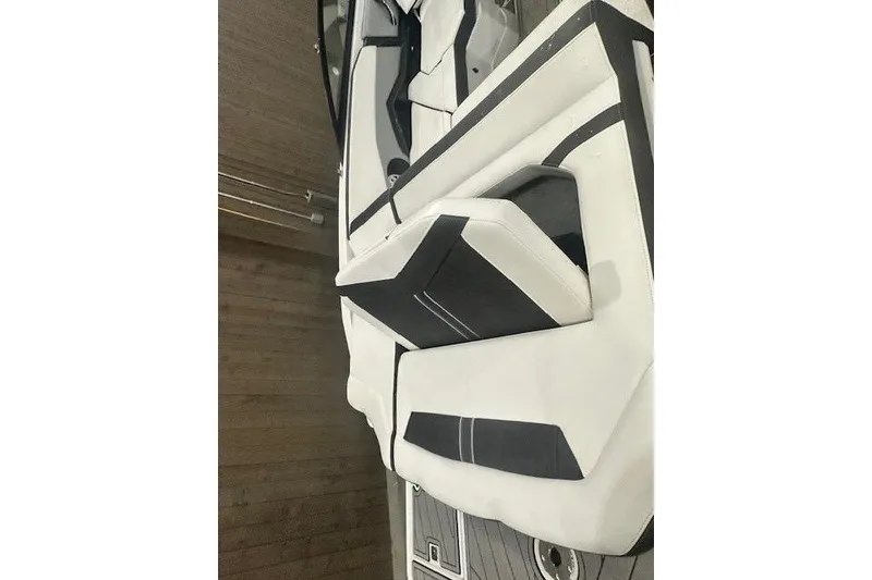 Slide: The Image of 2022 Monterey 238SS Super Sport boat interior with sleek white and black seating. - 17