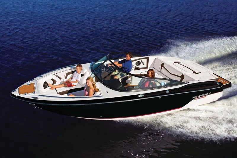 Slide: The Image of 2022 Monterey 238SS Super Sport boat with nautical flags and logo detail. - 2