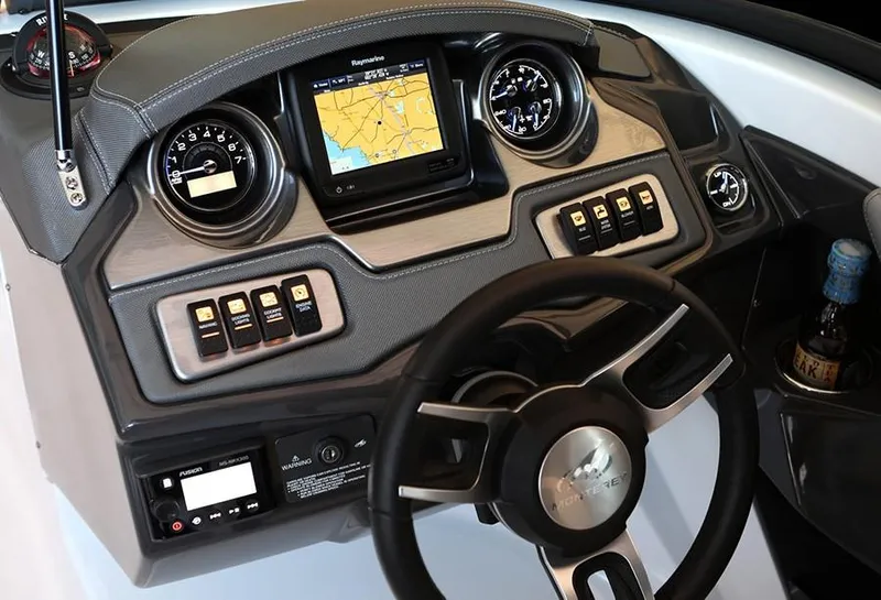 Slide: The Image of 2022 Monterey 238SS Super Sport boat storage compartment with a white cooler inside. - 4