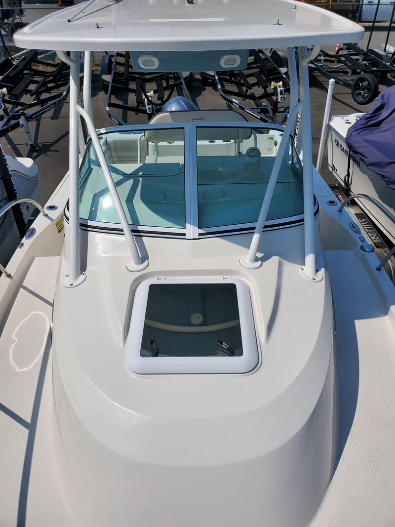 Slide: The Image of 2022 Sailfish 220 WAC boat with sleek design and spacious deck. - 15