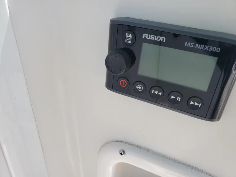 Slide: The Image of Fusion MS-NRX300 marine stereo on 2022 Sailfish 220 WAC boat dashboard. - 4