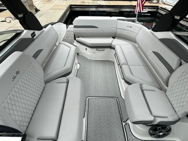 Slide: The Image of 2024 Sea Ray SLX 280 boat interior with luxurious seating and modern design. - 18