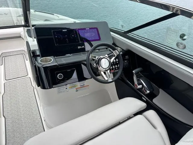 Slide: The Image of 2024 Sea Ray SLX 280 boat cockpit with modern steering and control panel. - 22