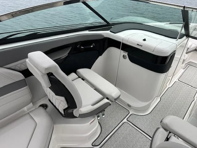 Slide: The Image of 2024 Sea Ray SLX 280 boat interior with white seating and sleek design. - 24