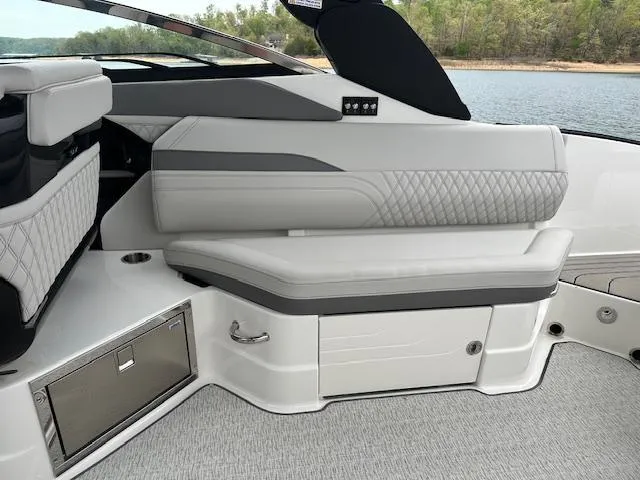 Slide: The Image of 2024 Sea Ray SLX 280 boat interior with luxurious seating and storage. - 27