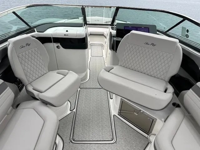 Slide: The Image of 2024 Sea Ray SLX 280 boat interior with luxurious seating and modern dashboard. - 28