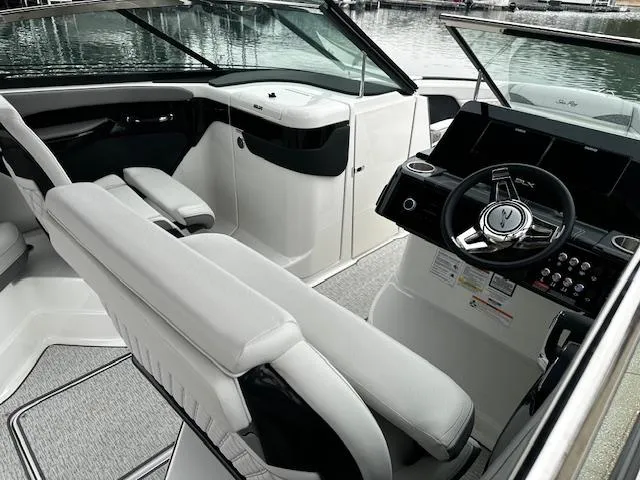 Slide: The Image of 2024 Sea Ray SLX 280 boat interior with helm and seating. - 31