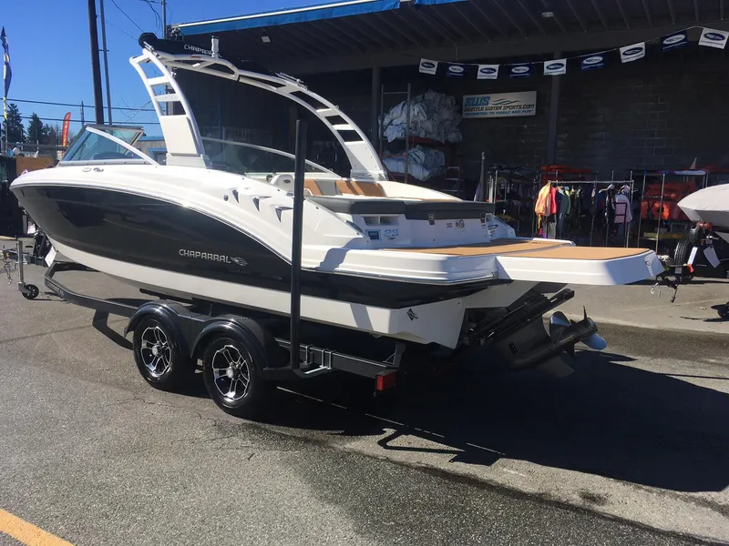 Slide: The Image of 2025 Chaparral 23 SSi boat on trailer, displayed outdoors. - 3