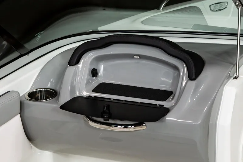 Slide: The Image of 2025 Chaparral 23 SSi boat interior storage compartment with cup holder. - 34