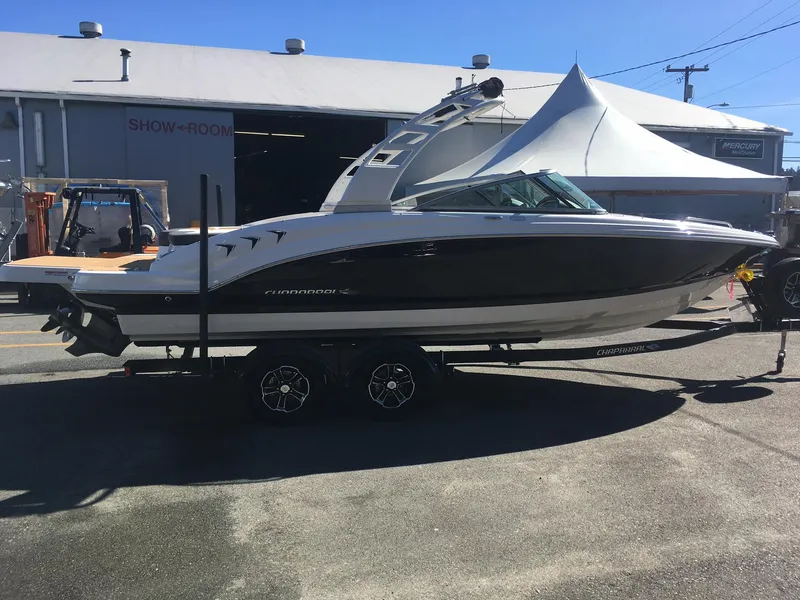 Slide: The Image of 2025 Chaparral 23 SSi boat on trailer outside showroom. - 4