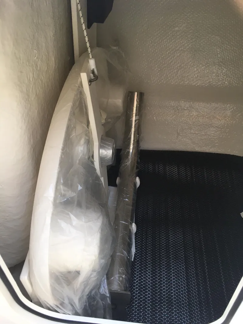 Slide: The Image of Interior storage compartment of 2025 Chaparral 23 SSi boat. - 6