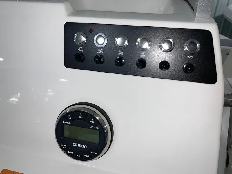 Slide: The Image of Control panel of 2024 Robalo 206 Cayman boat with Clarion audio system. - 15