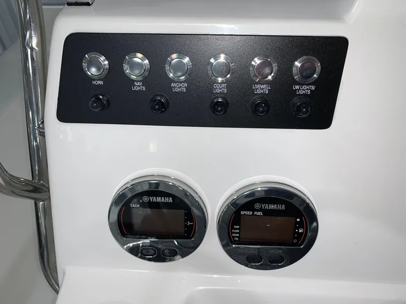 Slide: The Image of Control panel of 2024 Robalo 206 Cayman boat with Yamaha gauges and switches. - 12