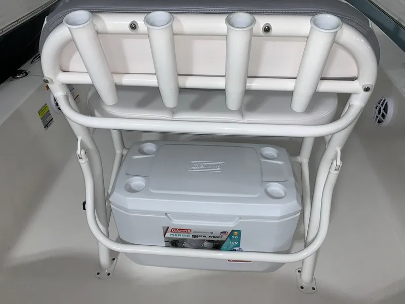 Slide: The Image of 2024 Robalo 206 Cayman boat with rod holders and cooler storage. - 6