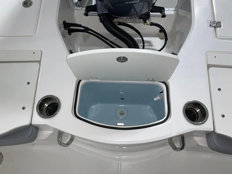 Slide: The Image of 2024 Robalo 206 Cayman boat livewell and storage compartments. - 8