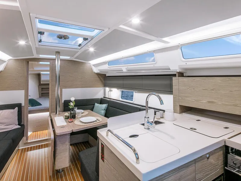 Slide: The Image of Modern interior of 2025 Hanse 388 yacht with sleek kitchen and dining area. - 11