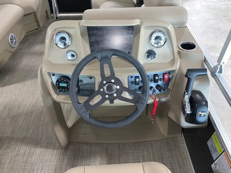 Slide: The Image of 2024 Starcraft LX20 R boat dashboard with steering wheel and control panel. - 4