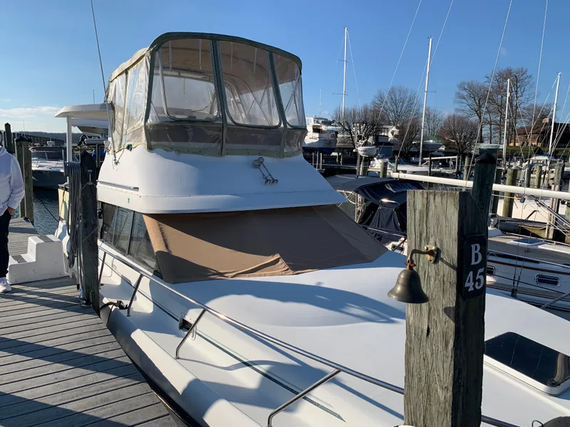 The Image of 1992 Silverton 34 Aft Cabin Motor Yacht docked at marina. - 0