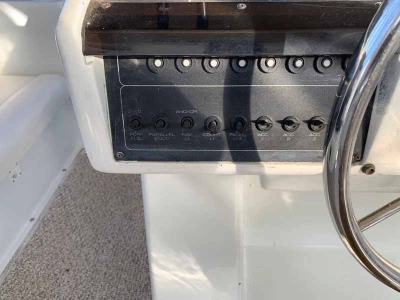 Slide: The Image of Control panel of a 1992 Silverton 34 Aft Cabin Motor Yacht with steering wheel. - 16