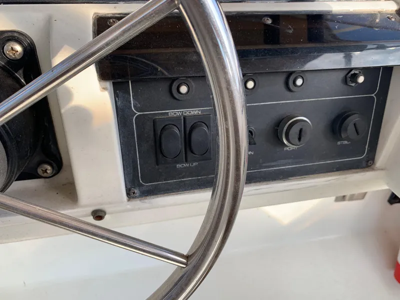 Slide: The Image of 1992 Silverton 34 Aft Cabin Motor Yacht steering wheel and control panel close-up. - 17